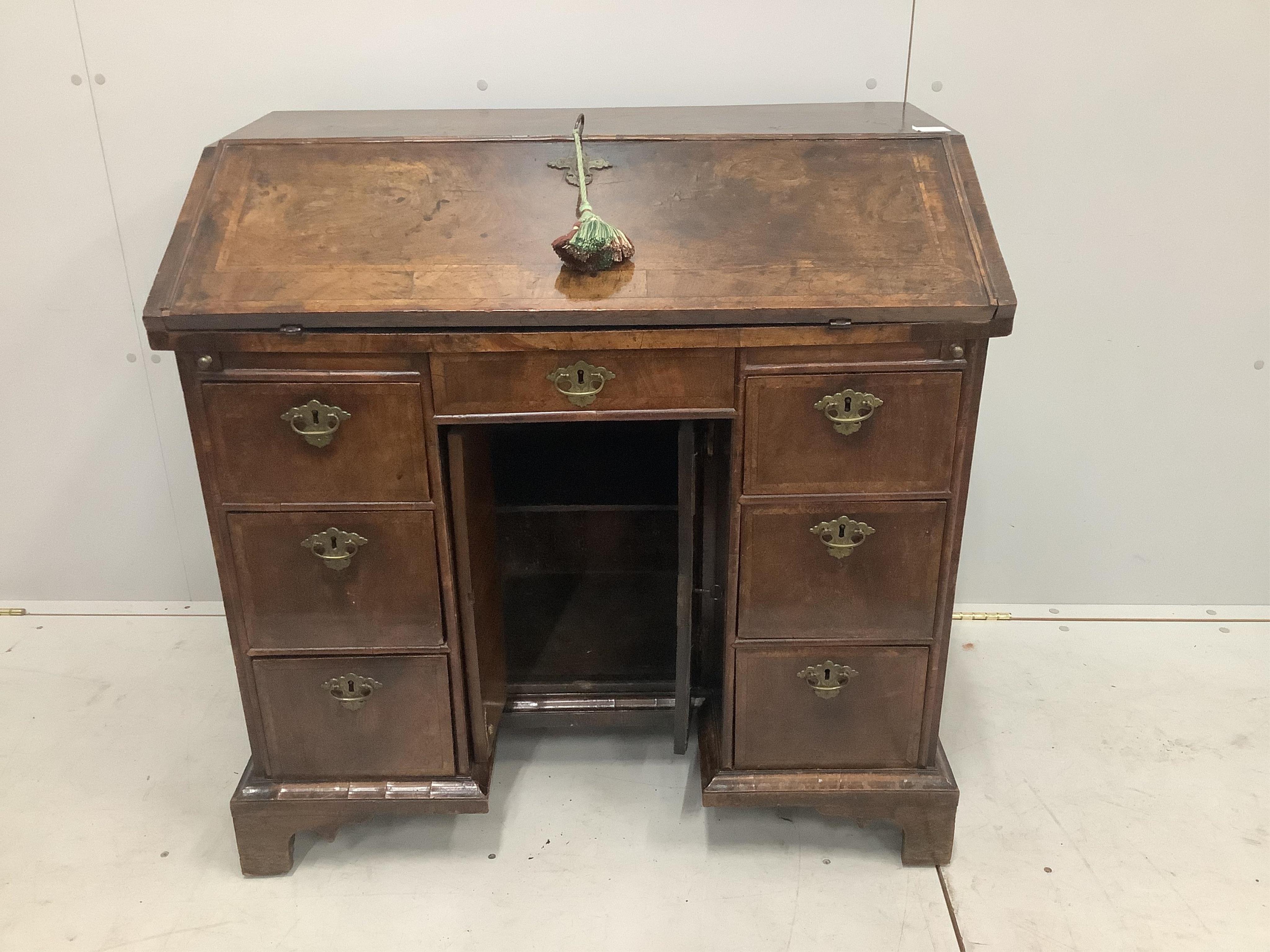 A rare William III walnut and featherbanded kneehole bureau, c.1700, with kneehole underframe, width 91cm, depth 55cm, height 88cm. Purchased from Mallett & Son of New Bond Street, 25th January 1954 for £270. Condition -